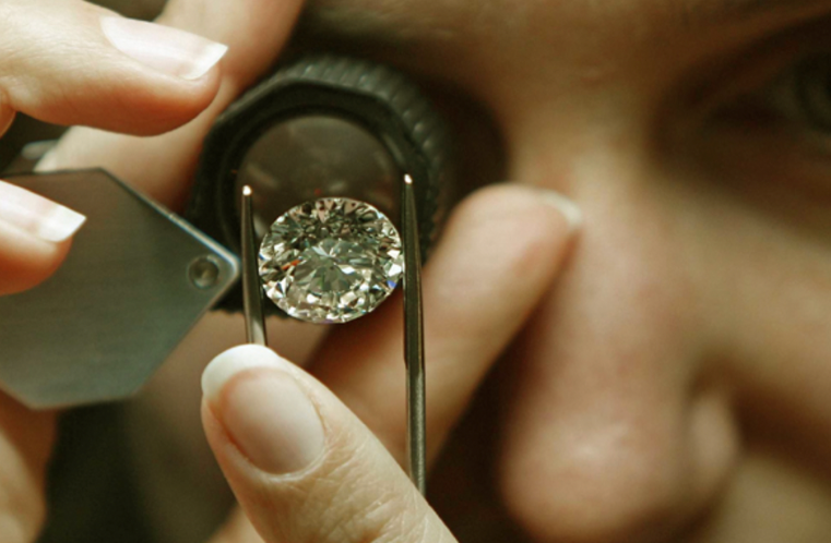 Hands holding a gemstone